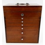 Vintage teak cased travelling dentist cabinet by The S S White Co of London, hinged lid with six