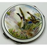 An enamel and silver circular compact, Garrard & Co., Birmingham 1957, the top depicting mallards in