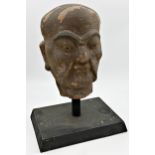 Chinese terracotta head sculpture of a gentleman, upon an ebonised stand, 49cm high