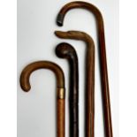 Four walking sticks - swordstick, horn handled crook, dog head and silver knop (4)