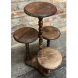 Vintage turned beech four tier cake stand, the moulded tops on turned supports, 74cm high