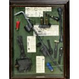 Vintage cased poachers diorama, with various iron traps and tools and cartridges, glazed case, 58