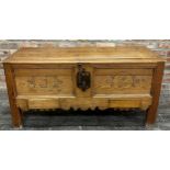 19th century black forest pitch pine marriage chest, the panelled front inscribed F and C, fitted