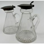 Matched pair of silver topper glass oil and vinegar jugs, star cut bases, 10cm high (2)