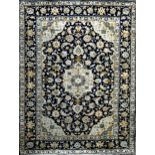 Good Keshan rug, gilt and sky blue scrolled foliate decoration on blue ground, 195 x 145cm