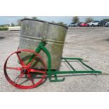 Antique painted iron hand cart trolly or water carrier, with red wheels with original large