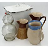 Mixed lot comprising vintage enamel lidded bread bin, three glazed pottery jugs and a vintage