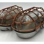 Pair of vintage Industrial ships bulk lamps, with coppered cages and Honex glass, 35 x 18cm (2)