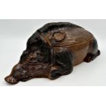 Good quality pottery tureen in the form of a recumbent warthog or boar, 46cm long