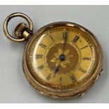 A 14K gold pocket watch, gilt metal dial with Roman numerals, engraved floral motif and central