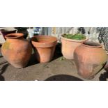 Two similar terracotta amphora type pots, with two further terracotta pots one planted (4)