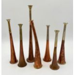Collection of six antique copper hunting horns, the longest 33cm long with a further hunting horn