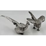 A pair of silver pheasants, cock and hen, Albion Craft Co., London 1970, largest 7.5cm high x 18cm