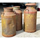 Three antique steel milk churns, inscribed Bristol Dairy (3) Height 75cm x 35cm Diameter