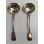 A Victorian matched pair of silver fiddle pattern ladles, one by Mary Chawner, London 1838, the