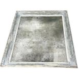 Antique French wall mirror, with distressed gesso painted frame and pitted glass fitted with