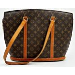 A classic Louis Vuitton Babylone tote bag in brown monogram canvas with tan leather trim and