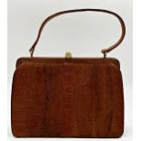 A beautiful 1940s brown snakeskin bag by Mappin & Webb. Hardware in gilt metal with strong clasp