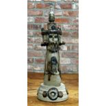 Unusual studio pottery figural table lamp in the form of a king holding a pigeon, 46cm high