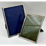 Two similar silver easel picture frames, 26 x 21.5cm and 23 x 18cm respectively (2)