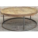Vintage industrial dished pine top coffee table on a tubular steel frame, 40cm x 100cm.