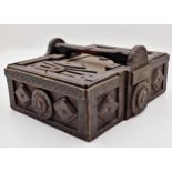 Primitive tramp art box with typical carved detail fitted with two glass cabochons, with slide