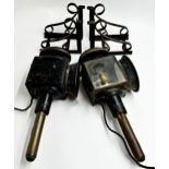 Pair of 19th century carriage lamps with scrolled wrought iron brackets, each 43cm high, converted