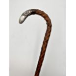 A late Victorian/Edwardian silver topped hawthorn walking stick, embossed floral decoration and