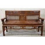 A Chinese possibly elm or hardwood hall bench, with carved panels of birds and dragons, further