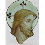 Antique stained glass panel on the head of Christ, believed to be reclaimed from Coventry
