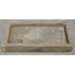 A shallow natural stone sink with drainage hole, 78 x 46cm