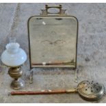 Brass oil lamp complete with shade and flute together with a brass bed warming pan with pierced