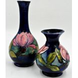 William Moorcroft 'magnolia' pattern bottle neck and baluster vase, 21 and 13cm high respectively (