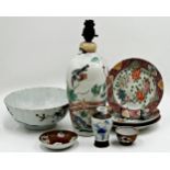 A mixed collection of 10th century and later Chinese porcelain, comprising a tea cup and saucer