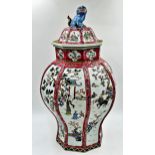 Chinese porcelain famille rose faceted baluster lidded vase, mounted by a seated dog of Fo with