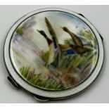 An enamel and silver circular compact, Garrard & Co., Birmingham 1957, the top depicting mallards in