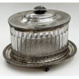 Good quality silver plate and cut glass oval biscuit barrel, the hinged lid over a fluted cut