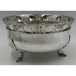 Exceptional quality Edwardian silver fruit bowl, pierced scrolled rim and cast floral feet, maker