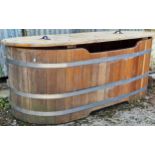 A good coopered barrel bath tub/planter with removable lid and drainage hole, 64cm high x 160cm long