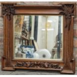 Good 19th century Anglo-Indian carved teak wall mirror, with palm tree pilasters and further