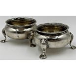 Pair of Victorian silver table salts, gardrooned rim and gilt interior, maker marks worn, London