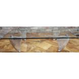 Matthew Hilton - "Flipper" glass top coffee table raised on four stylised aluminium supports, 29 x