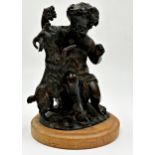 Cast bronze character group of a Bacchus-style cherub with goat, stepped circular marble plinth