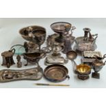 Collection of silver plate to include sugar bowls, tazza, claret jugs, chamberstick, shell shaped