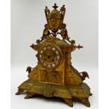 French Empire gilt spelter mantel clock with 2 train dial with inset enamel cabochon Roman numerals,