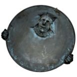 Cold cast resin bronzed sun dial base in the form of a clown holding a disc, 50cm diameter