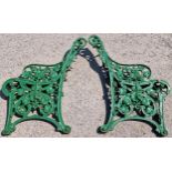 A pair of cast iron Coalbrookdale Nasturtium design bench ends with green painted finish, 82cm high