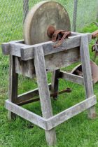 Two vintage grinding wheels on stands (2)