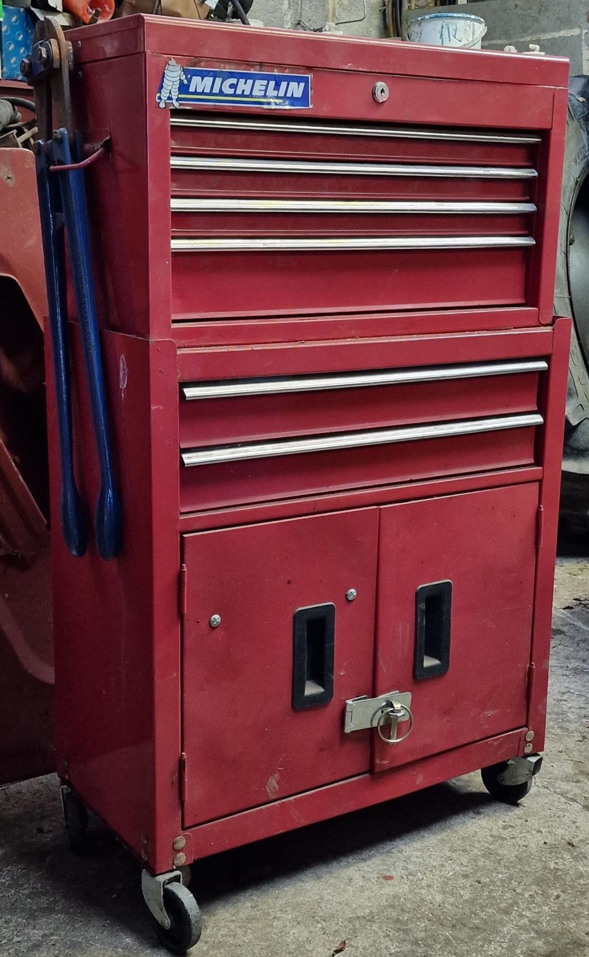 Metal two tier stacking tool cabinet complete with a large assortment of good tools and hardware,