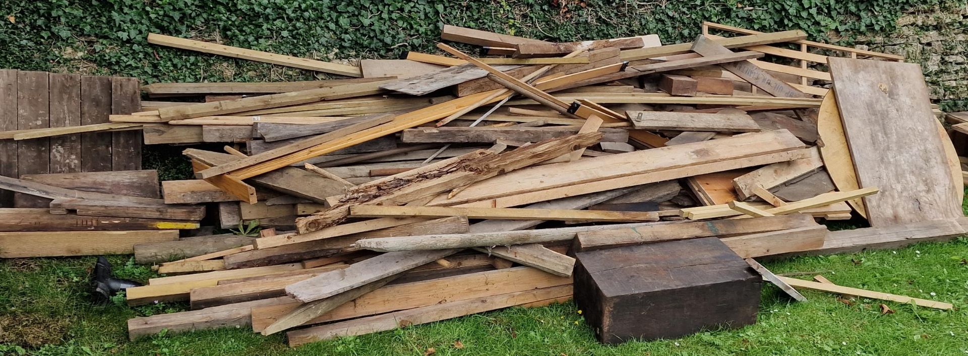 Large wood pile of various timbers